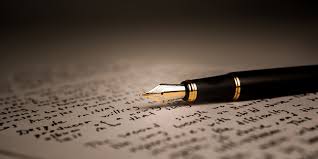Hands writing in a notebook